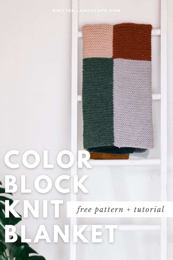 A color block knit blanket hanging on a ladder.