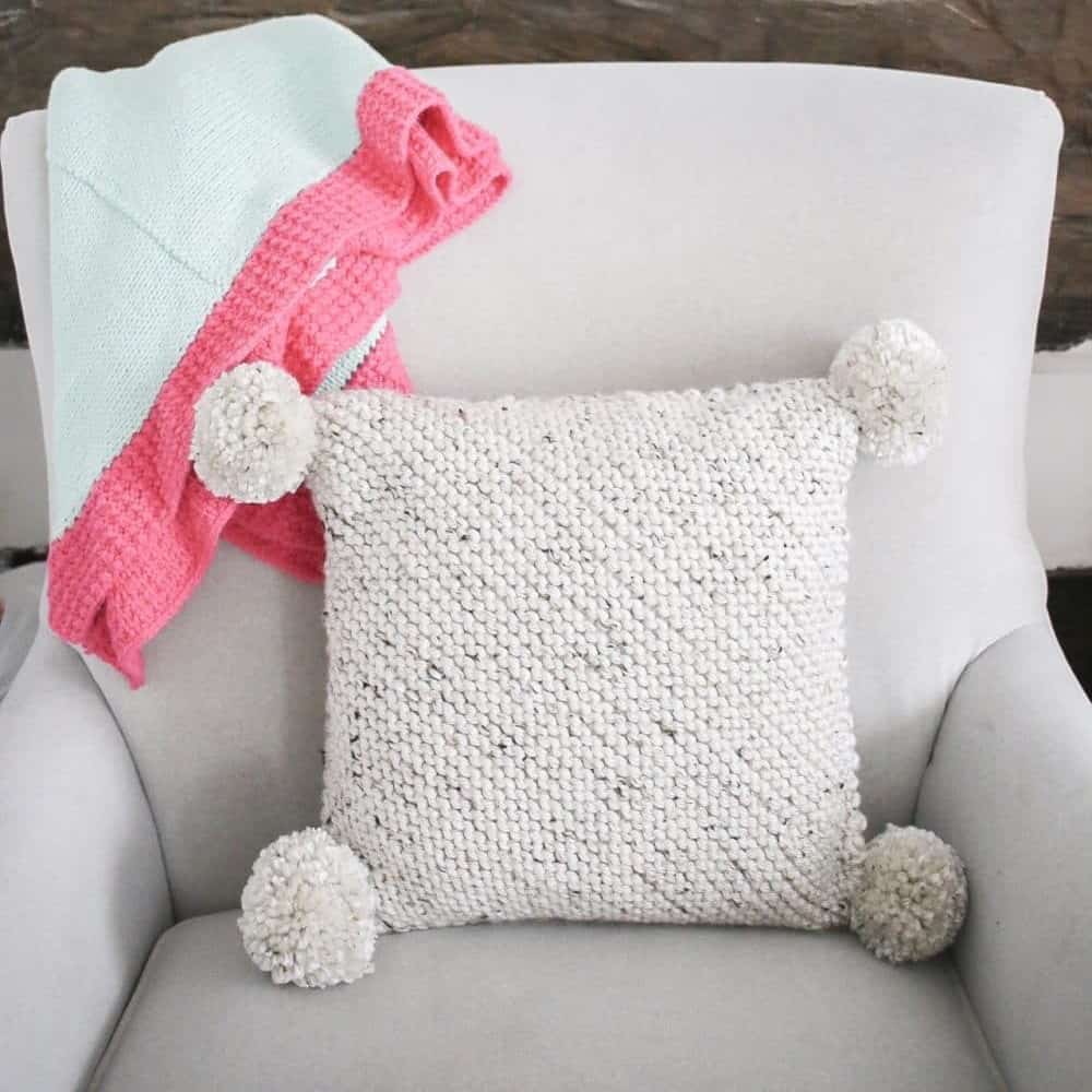 https://knittedlandscape.com/wp-content/uploads/2023/06/knit-pom-pom-pillow.jpeg